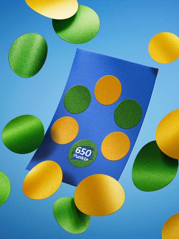 Man sieht das Rubbellos, auf dem ein Punkt freigerubelt ist. Er zeigt 650 Punkte. Rund um das Los fliegen weitere Punkte.